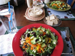 Salad, crackers, and hummus 