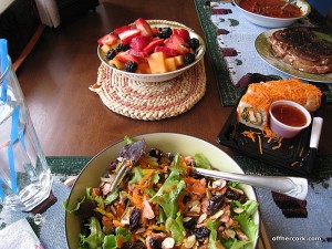 Salad, sushi, fruit 