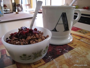 Mug of coffee and bowl of yogurt and granola 