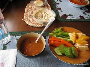 Soup, veggies, and a orange