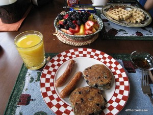 Pancakes, sausage, and fruit 