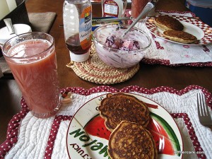 Pancakes, juice, and fruit 