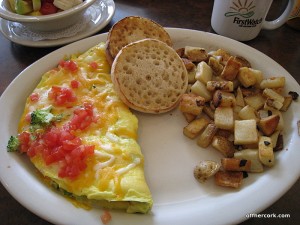 Omlette, potatoes, and an english muffin 