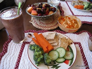 Fruit, hummus, veggies, and crackers 