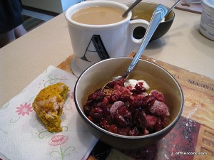 Coffee, scone, yogurt and granola 
