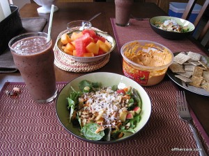 Smoothie, salad, fruit, and hummus 