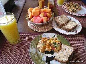 Juice, eggs, toast, and fruit