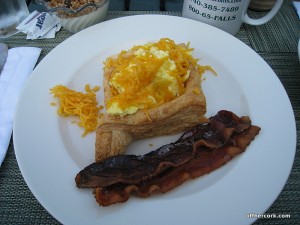 Scrambled eggs, puff pastry, and bacon 