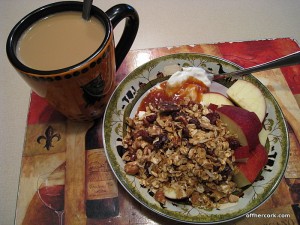 Coffee, yogurt, granola and an apple