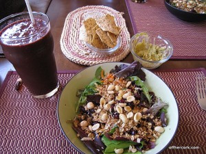 Smoothie, salad, chips, and guacamole