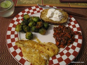 Fish, beans, baked potato, and brussels sprouts 