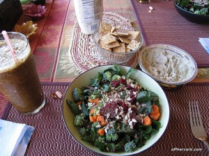 Smoothie, salad, crackers, and hummus 