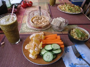 Smoothie, fruit, veggies, crackers, hummus, and noodles 