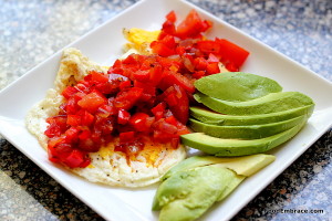 Fried eggs with peppers, onions, and avocado