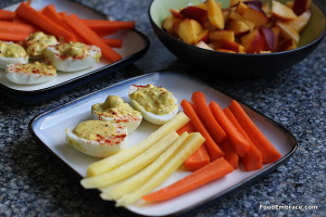 deviled eggs, carrots, fruit